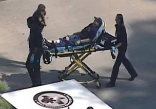 In this frame grab provided by KPRC Houston, an unidentified person is transported by emergency personnel at Lone Star College Tuesday, Jan. 22, 2013, in Houston, where law enforcement officials say the community college is on lockdown amid reports of a shooter on campus.  