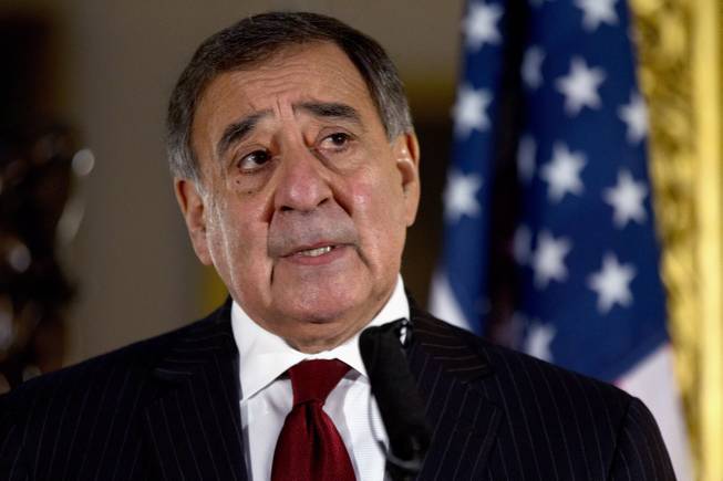 This Jan. 19, 2013, file photo shows Defense Secretary Leon Panetta speaking during a news conference in London. Panetta has removed US military ban on women in combat, opening thousands of front line positions.