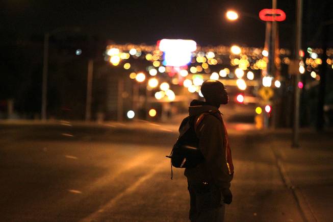 Volunteer Robert Jennings conducts a census of the homeless in Clark County on Main Street looking north in downtown Las Vegas early in the morning on Thursday, January 24, 2013.