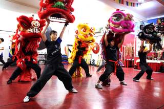 Students Yuko Brazil, from left, and Michael Buenavista practice the lion dance for Chinese New Year at Lohan School of Shaolin in Las Vegas on Thursday, January 24, 2013.