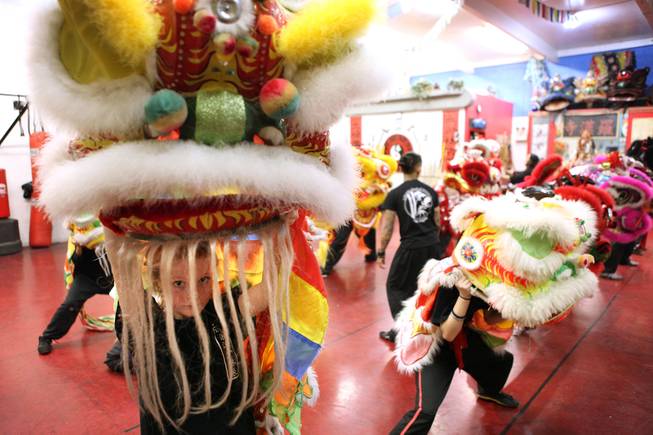 Student Natasha Venola, far left, 11, practices the lion dance for Chinese New Year at Lohan School of Shaolin in Las Vegas on Thursday, January 24, 2013.