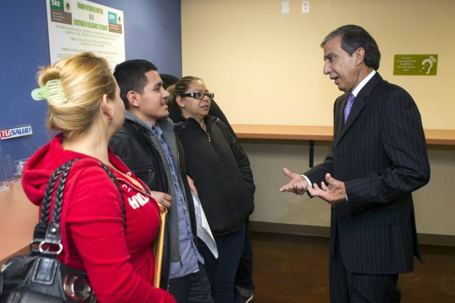 Mariano Lemus Gas, right, Mexican consul in Las Vegas, talks with Bryan Yanez, 19, center left, at the Mexican Consulate at Hoover Avenue and Sixth Street Thursday, Jan. 24, 2013. Lemus Gas is leaving after eight years in Las Vegas. STEVE MARCUS