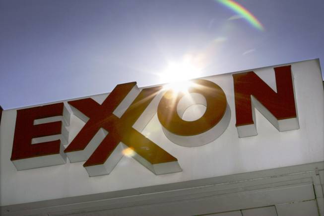 This Oct. 26, 2006, file photo shows an Exxon logo seen at a Dallas gas station. Exxon has once again surpassed Apple as the world's most valuable company after the iPhone and iPad maker saw its stock price falter, according to reports Friday, Jan. 25, 2013. Apple first surpassed Exxon in the summer of 2011. The two companies traded places through that fall, until Apple surpassed Exxon for good in early 2012.