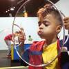 Amari Hall blows bubbles at Lied Discovery Children's Museum Saturday, Jan. 26, 2013.