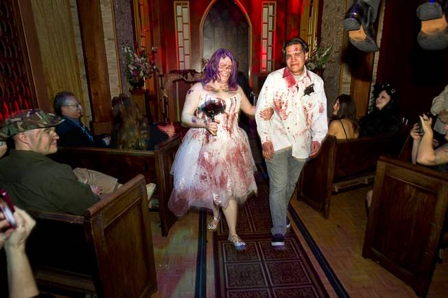 Rosie Grasso and Anthony Gallegos of Las Vegas leave the chapel after getting married in Eli Roths Goretorium Sunday, Jan. 27, 2013.