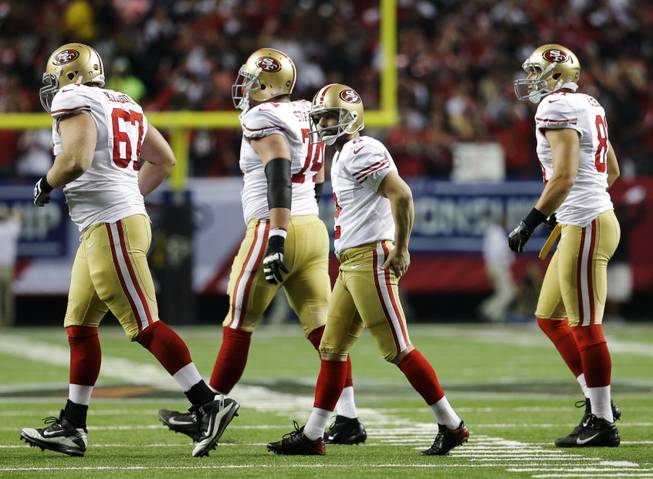 San Francisco 49ers kicker David Akers, second right, walks off the field after missing a field goal during the second half of the NFL football NFC Championship game against the Atlanta Falcons Sunday, Jan. 20, 2013, in Atlanta.
