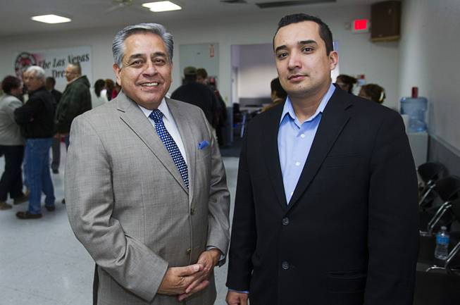Fernando Romero, left, president of Hispanics in Politics, and Eddie Ramirez, representing the Laborers-Employers Cooperation and Education Trust (LECET), pose following a gathering of union leaders, working families and community partners at the Culinary Workers Local 226 union hall Tuesday, Jan. 29, 2013.