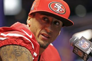 San Francisco 49ers quarterback Colin Kaepernick answers reporters' questions during media day Tuesday, Jan. 29, 2013, for Super Bowl XLVII in New Orleans. 