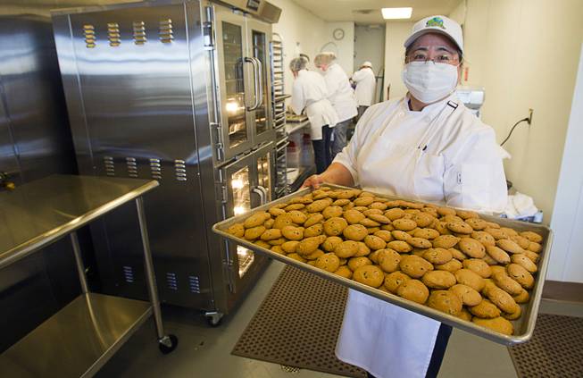 Jane Lee, owner and president of Jadon Foods, poses at the bakery with a tray of gluten-free cookies Wednesday, Jan. 30, 2013. Jadon Foods is a gluten-free bakery that also specializes in diabetic-friendly and dairy-free baked goods.