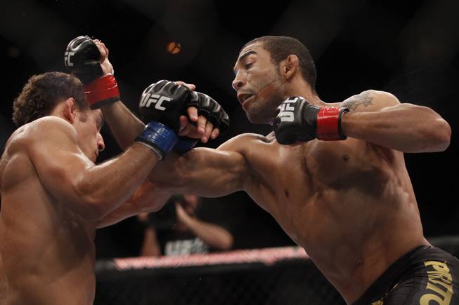 Jose Aldo right, punches Chad Mendes during their featherweight title bout at UFC 142 in Rio de Janeiro on Sunday Jan. 15, 2012. Aldo defended his belt by defeating Mendes in the first round.