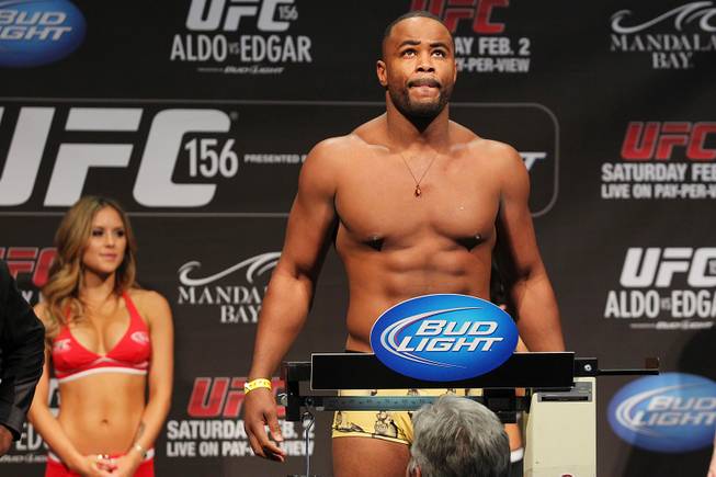Rashad Evans stands on the scale during weigh ins for UFC 156 Friday, Feb. 1, 2013.