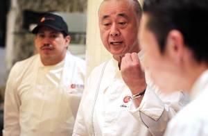 Chef Nobu Matsuhisa talks to his staff at the new Nobu Restaurant at Caesars Palace in Las Vegas on Friday, Feb. 1, 2013.