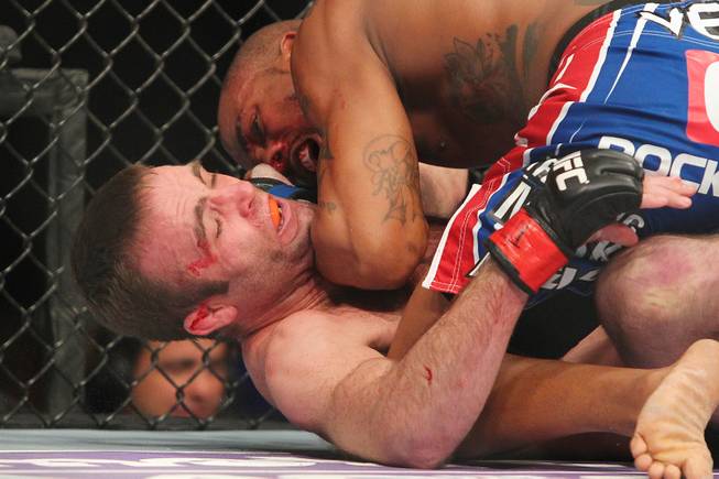 Bobby Green drops an elbow on Jacob Volkmann's chin during their bout at UFC 156 Saturday, Feb. 2, 2013 at the Mandalay Bay Events Center.