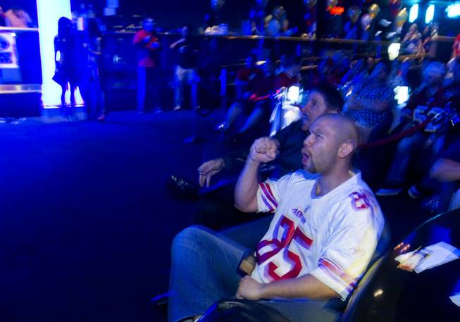 Greg (no last name given) from San Francisco cheers on the San Francisco 49ers during a Super Sunday party at the Sapphire Las Vegas strip club Sunday, Feb. 3, 2013.