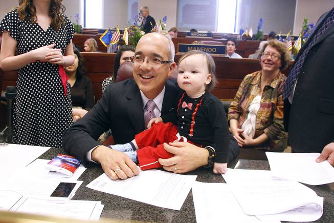 Senator Mo Denis holds his grandson Anderson Gale on the first day of the 2013 legislative session Monday, Feb. 4, 2013 in Carson City.