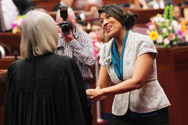 Assemblywoman Lucy Flores greets Nevada Supreme Court Chief Justice Kristina Pickering on the first day of the 2013 legislative session Monday, Feb. 4, 2013 in Carson City.