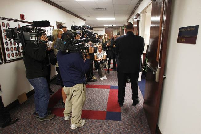 Members of the media wait outside the Assembly Leadership Office for Assemblyman Steven Brooks to emerge from a meeting on the first day of the 2013 legislative session Monday, Feb. 4, 2013 in Carson City.