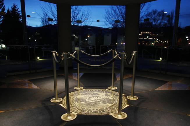A carved Nevada state seal is protected by stanchions in the entry of the Legislative Building at the end of the first day of the 2013 legislative session Monday, Feb. 4, 2013 in Carson City.
