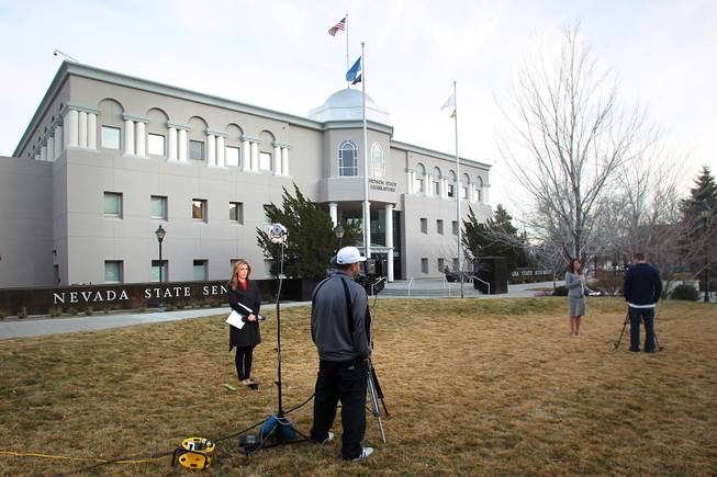 Television reporters do live shots in front of the Legislative Building on the second day of the 2013 legislative session Tuesday, Feb. 5, 2013 in Carson City.