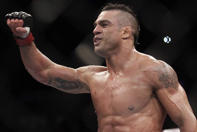 Vitor Belfort, from Brazil, celebrates after defeating Michael Bisping, from Britain during their middleweight mixed martial arts bout at the Ultimate Fighting Championship (UFC) in Sao Paulo, Brazil, Sunday, Jan. 20, 2013.