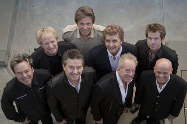 Members of the band Chicago, shown in posed formation. Bottom row, from left: Lou Pardini, Walt Parazaider, Jimmy Pankow, Tris Imboden 
Middle row, from left: Lee Loughnane, Jason Scheff, Keith Howland. Top row: Robert Lamm.