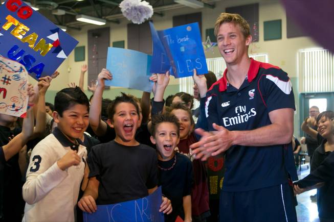 Colin Hawley of the USA Eagels Rugby Team visits with students at Glen Taylor Elementary School, Tuesday Feb. 5, 2013.