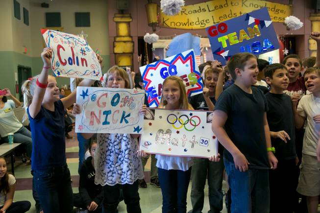 Students at Glen Taylor Elementary School welcome the USA Eagels Rugby Team, Tuesday Feb. 5, 2013.