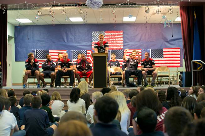 Colin Hawley of the USA Eagels Rugby Team answers questions from students during a pep rally at Glen Taylor Elementary School, Tuesday Feb. 5, 2013.