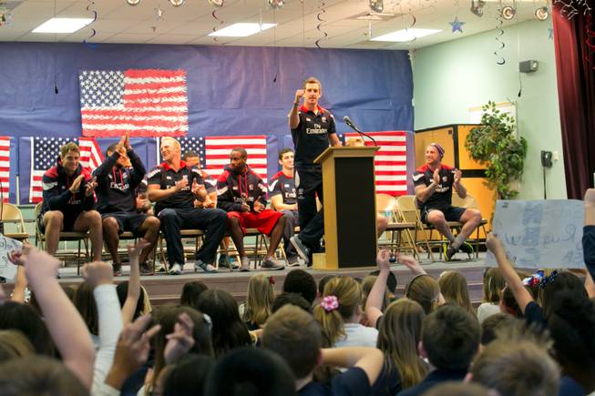 Zachary Test of the USA Eagels Rugby Team answers questions from students during a pep rally at Glen Taylor Elementary School, Tuesday Feb. 5, 2013.