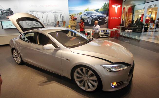 A Tesla Model S is shown in the showroom at Washington Square Mall on July 20, 2012, in Portland, Ore. Tesla Motors produces electric cars that can go from 0 to 60 mph in less than 6 seconds, all without a drop of gasoline. 
