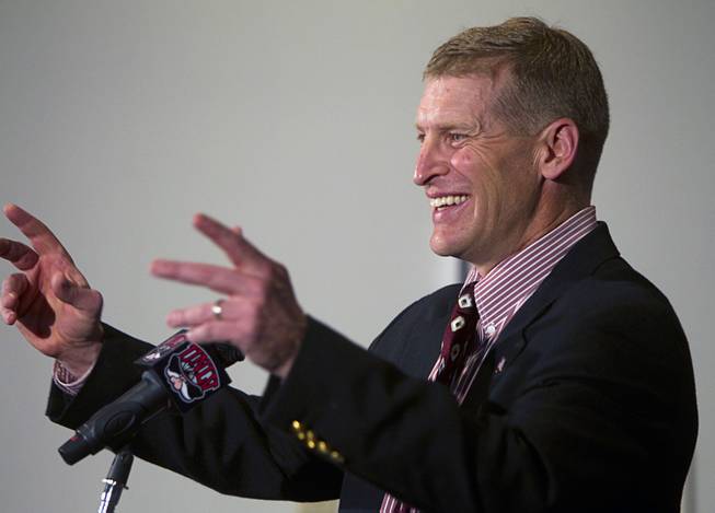 UNLV football coach Bobby Hauck, gestures to reporters in the audience as he announces the Rebels' 2013 recruiting class during a news conference at the Thomas & Mack Center Wednesday, February 6, 2013.