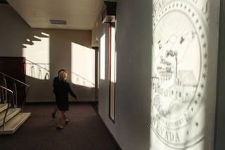 The late afternoon sun casts a shadow of the Nevada state seal on the wall of the Legislative Building on the third day of the 2013 legislative session Wednesday, Feb. 6, 2013 in Carson City.