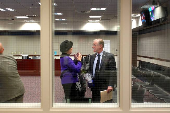 Lobbyist Carole Vilardo talks with Senator David Parks during the third day of the 2013 legislative session Wednesday, Feb. 6, 2013 in Carson City.