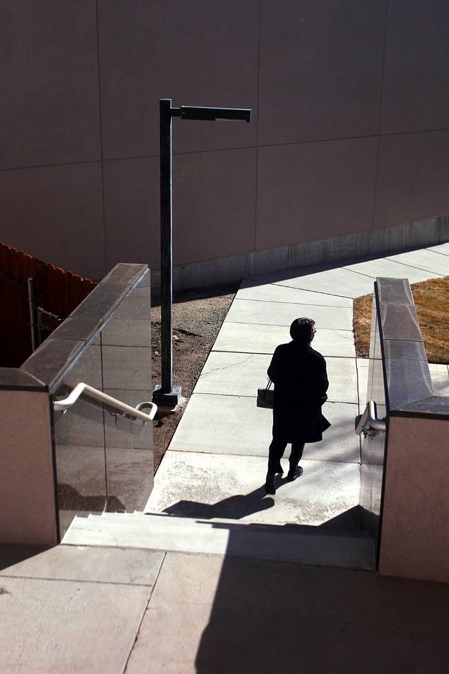 A person exits the Legislative Building during the third day of the 2013 legislative session Wednesday, Feb. 6, 2013 in Carson City.