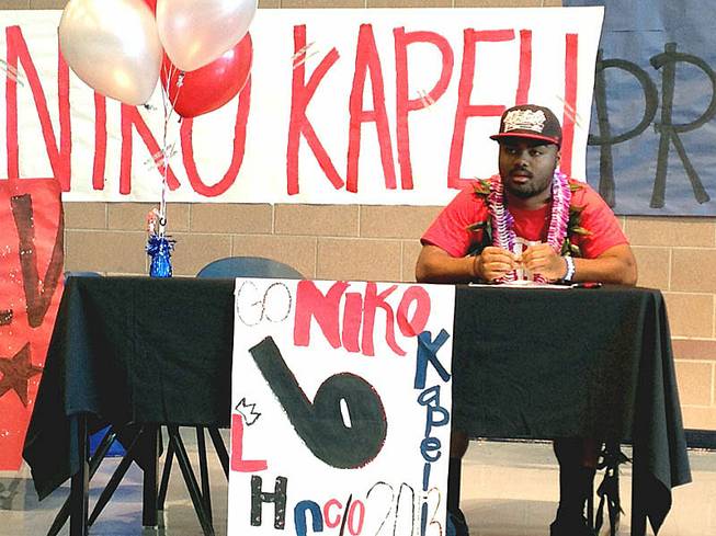 Liberty football player Niko Kapeli signed a national letter of intent Wednesday, Feb. 6, to play for UNLV.