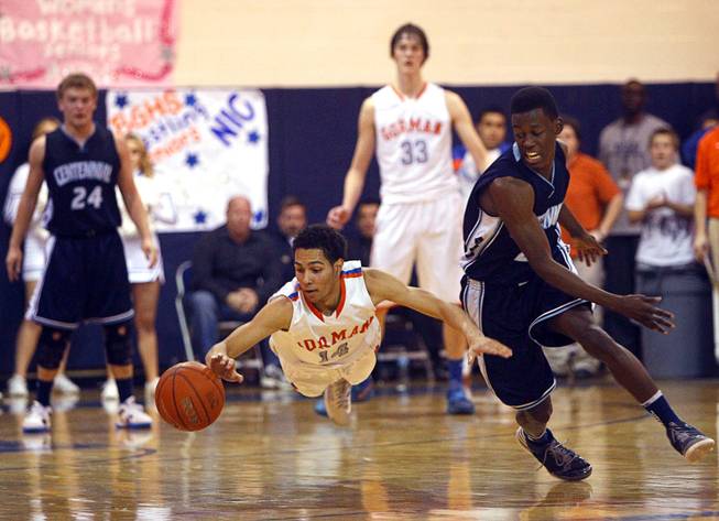 Awarded second place in "Best Sports Photo" category by the Nevada Press Association. Bishop Gorman's Noah Robotham, left, dives for a loose ball during a game against Centennial High School at Bishop Gorman Thursday, Feb. 7, 2013. Centennial's Malcolm Allen is at right. Bishop Gorman beat Centennial 79-71 in double overtime.