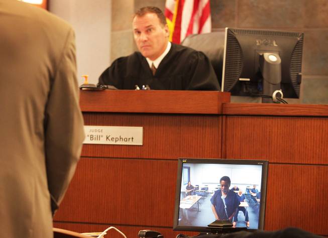 Keith Barlow appears for a felony arraignment via live video feed from Clark County Detention Center before Judge Bill Kephart in Las Vegas Justice Court at the Regional Justice Center in Las Vegas on Thursday, February 7, 2013.