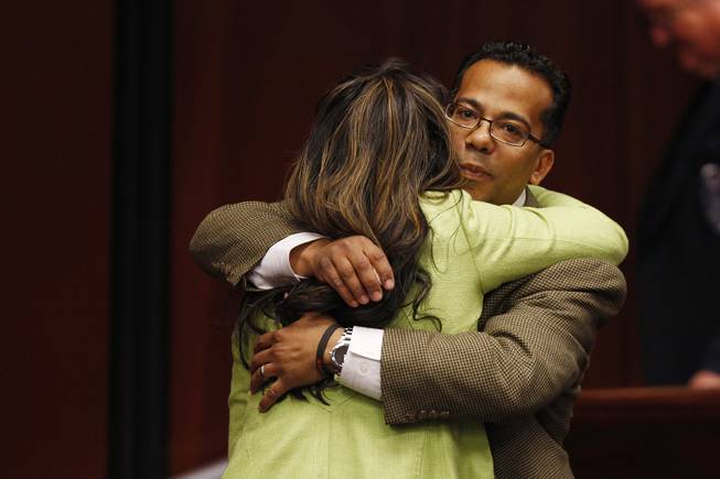 After calling her over, Assemblyman Steven Brooks hugs Assemblywoman Lucy Flores Thursday, Feb. 7, 2013 during the 2013 legislative session in Carson City.