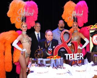 Penn & Teller's 20th-anniversary performance and celebration at The Rio on Friday, Feb. 8, 2013. The magic duo is pictured here with 