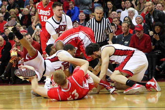 UNLV and New Mexico played chase after a loose ball during their game Saturday, Feb. 9, 2013 at the Thomas & Mack Center. UNLV beat New Mexico 64-55.
