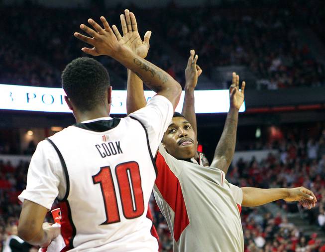UNLV guard Daquan Cook and Justin Hawkins high five during their game against New Mexico during their game Saturday, Feb. 9, 2013 at the Thomas & Mack Center. UNLV beat New Mexico 64-55.