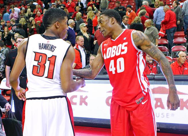 Former AAU teammates, UNLV guard Justin Hawkins and New Mexico guard Demetrius Walker talk after their game Saturday, Feb. 9, 2013 at the Thomas & Mack Center. UNLV beat New Mexico 64-55.
