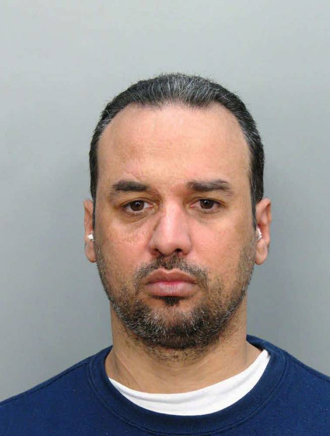 An undated handout photo provided by the Miami Dade Corrections and Rehabilitation Department shows Alberto Morales. A manhunt is under way for Morales, a prisoner convicted of kidnapping and sexual assault, who stabbed one of two police escorts and escaped in the Dallas area as he was being transferred from Florida to Nevada, police said Tuesday Feb. 12, 2013.