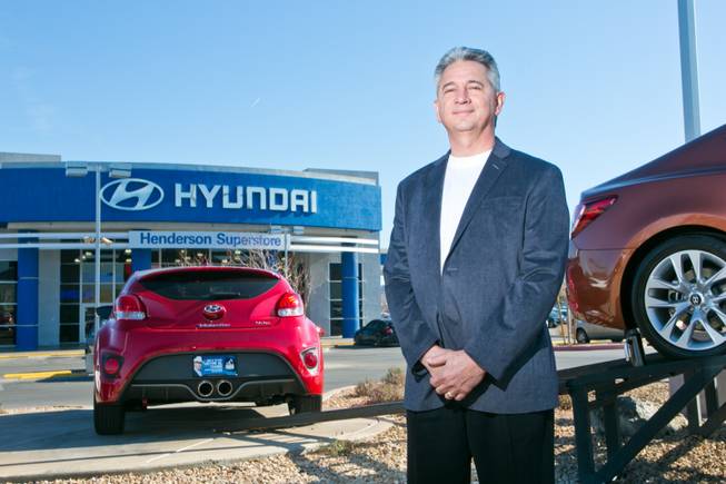 Frank Maione, owner of Henderson Hyundai Superstore, stands on the lot of his dealership, Tuesday, Feb. 12, 2013.