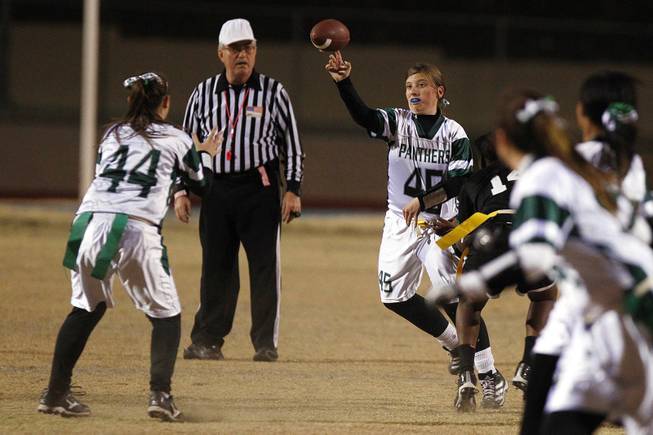 Palo Verde quarterback Kaitlyn Millican passes to Caitlin Oxford during their district championship flag football game against Silverado Wednesday, Feb. 13, 2013. Palo Verde won the game 7-6.