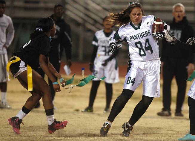 Palo Verde's Sydney Tuiofea is downed by Silverado's LaShayla Peters during the district championship for flag football Wednesday, Feb. 13, 2013. Palo Verde won the game 7-6.