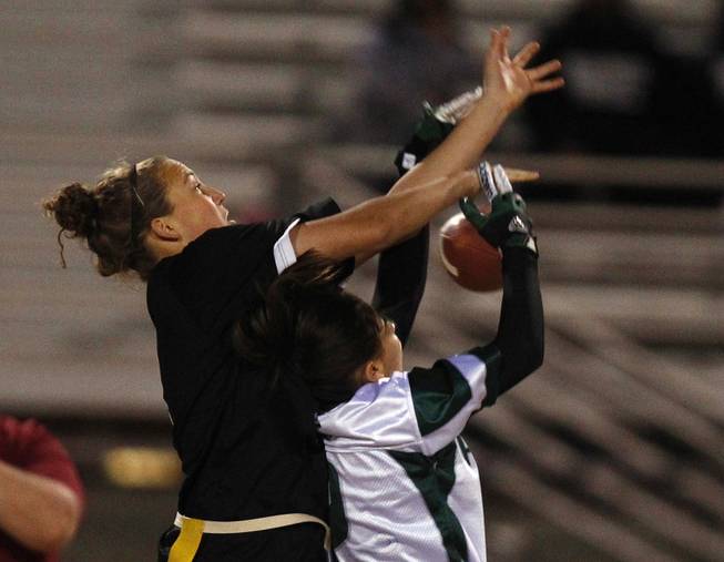 Silverado's Nina Jensen breaks up a pass intended for Palo Verde's Alexa D'Acunto during the district championship for flag football Wednesday, Feb. 13, 2013. Palo Verde won the game 7-6.
