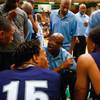 File photo: Canyon Springs High basketball coach addresses his team in the huddle during a game in the 2013 season.