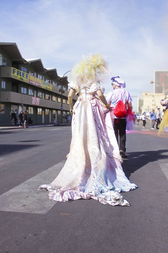 A participants wearing a wedding dress and veil is seen leaving the 5K Color Run, Saturday, Feb. 16, 2013. 