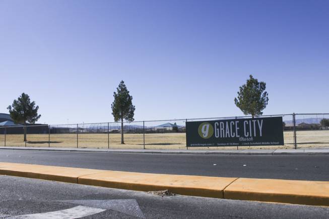A Grace City Church banner hangs on the Jack Schofield Middle playground fence, Sunday, Feb. 17, 2013. The new Las Vegas church rents out the Jack Schofield Middle School auditorium as a temporary venue to hold they're Sunday services.